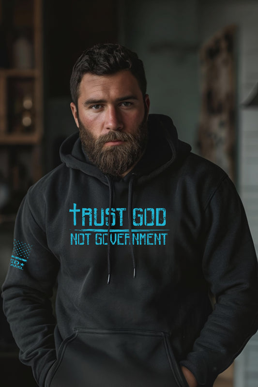 Unisex black hoodie with blue Trust God Not Government graphic
