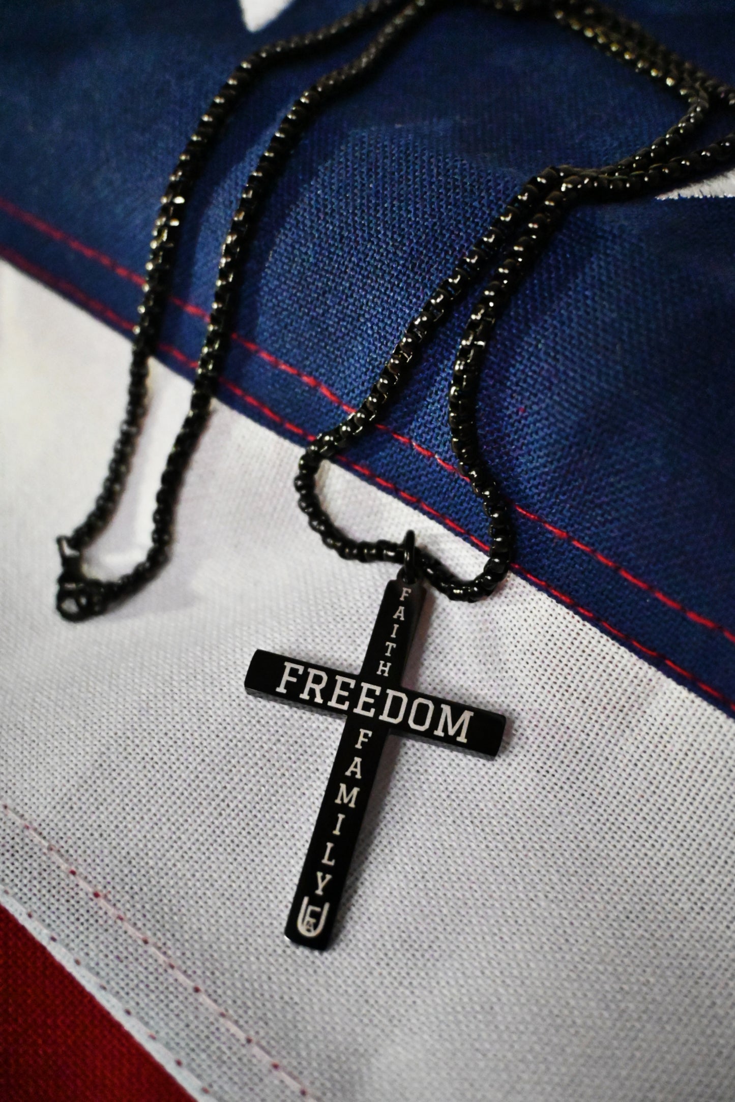 Back view of cross pendant with powerful conservative message