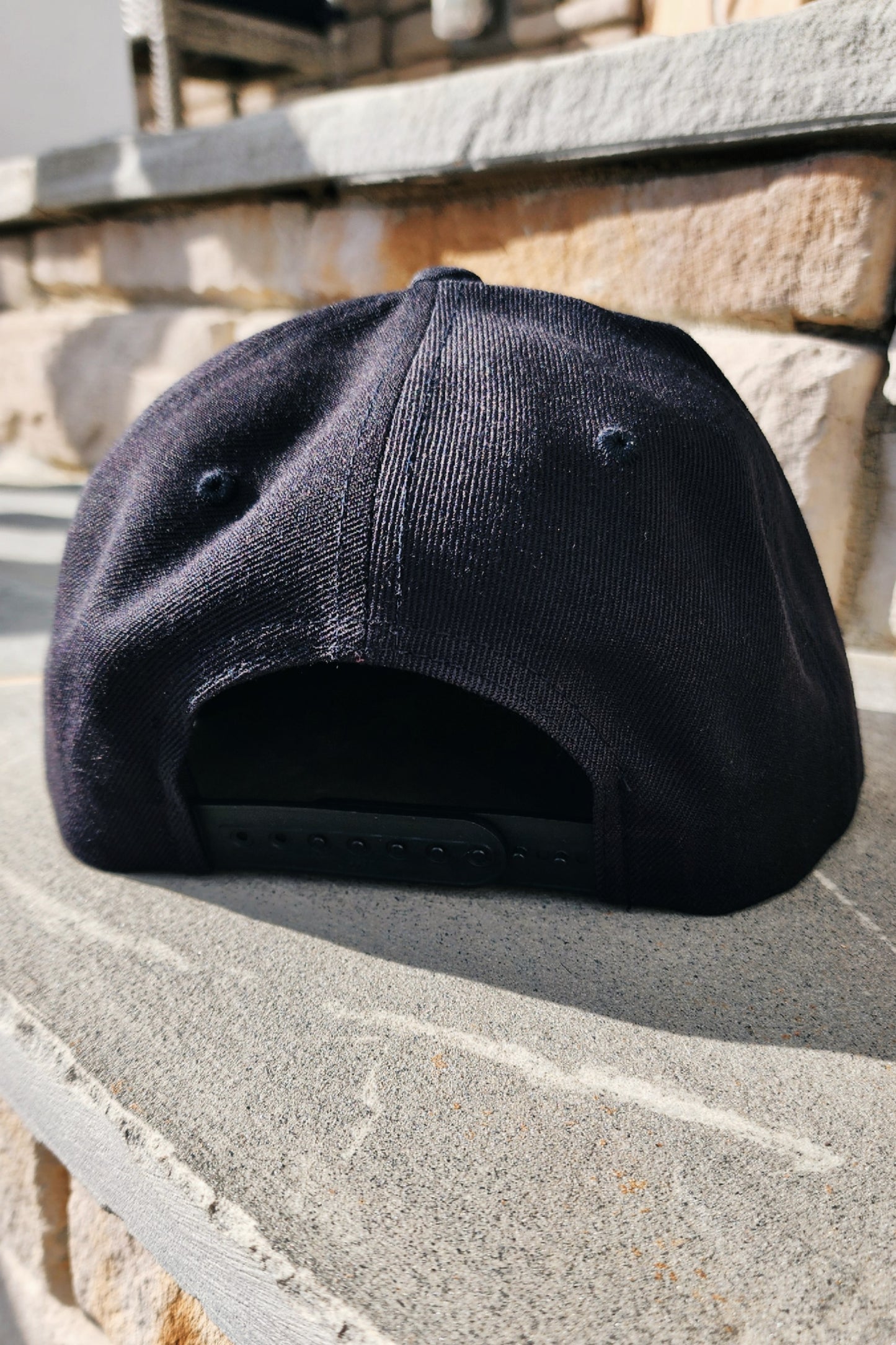 Structured snapback with bold constitutional phrase