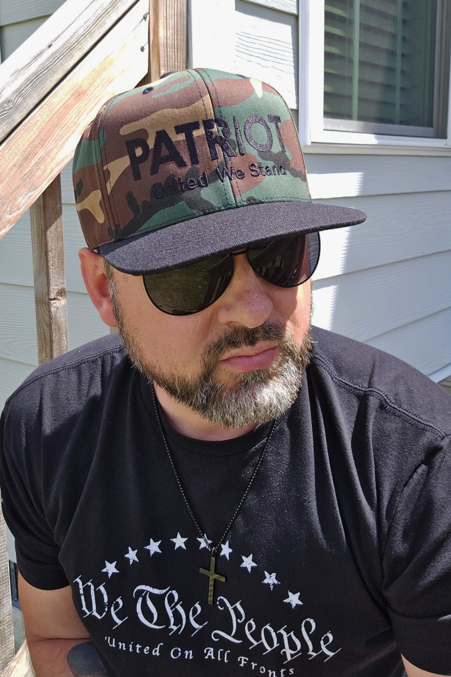 Flat bill camo hat with bold patriotic embroidery